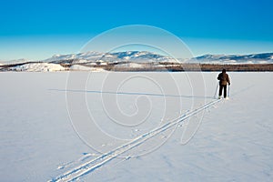 Cross-Country Skier on frozen Lake