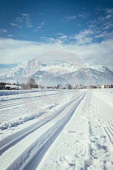 Cross-country skiing in Austria: Slope, fresh white powder snow and mountains