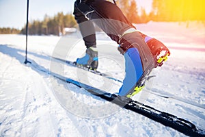 Cross country skiing Banner, winter sport on snowy track, sunset background