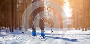 Cross country skiing Banner, winter sport on snowy track, sunset background