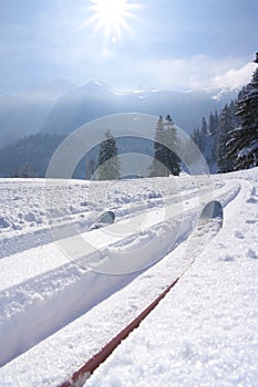 Cross Country skiing with blue sky in the austrian mountains