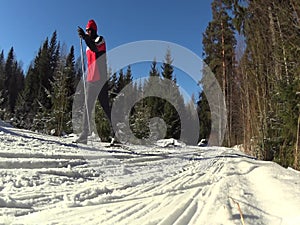 Cross country skiing man passing by