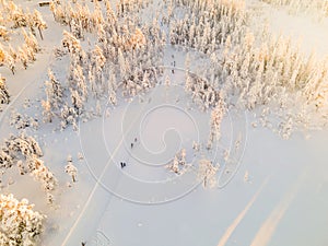 Cross country skiing slope with people skiing