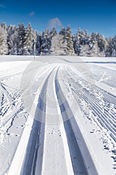 Cross-country skiing track in winter landscape