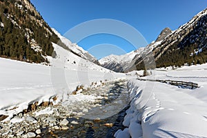 Cross-country skiing trail through the Pitztal near Sankt Leonhard in Tirol, winter sports in snowy landscape in the Austrian Alps