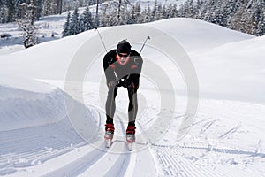 Cross-country skiing on a trail in snowy landscape