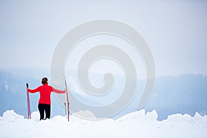 Cross-country skiing: young woman cross-country skiing