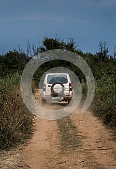 Cross Country Vehicle SUV On Dusty Gravel Road In Croatia