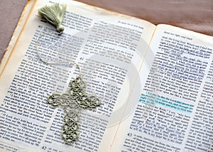 Cross Covers Pages of Bible