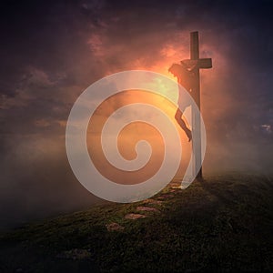 The cross with dark skies photo