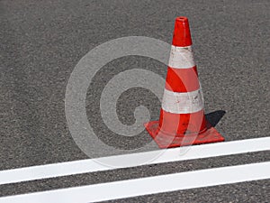 The cross-decorated pedestrian crossing with the still not dried out red. Restriction of traffic by road signs. Update road pedest