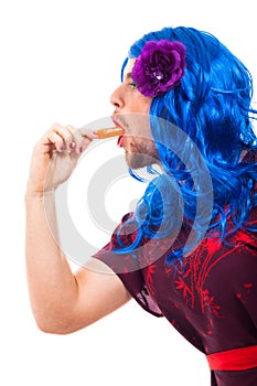 Cross dressing man with ice pop