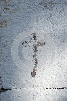 Cross etched on wall of old church