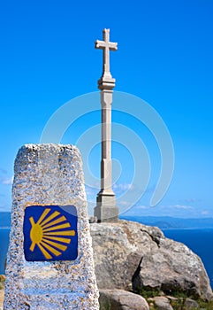 Cross in finisterre end of Saint James Way in Spain photo