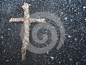 Cross on gray stone background