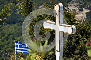 Cross and Greek flag in front of Tsambika Monastery, RHODES, GR