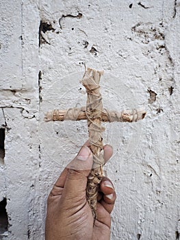 Cross and hand on white background