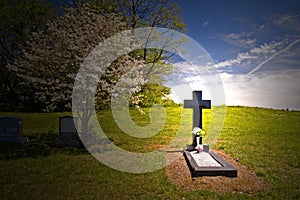Cross headstone on grave