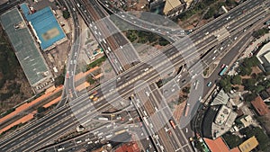 Cross highway top down at Philippines cityscape aerial. Cars, buses, vans, trucks at traffic road