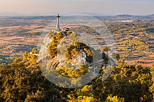 Cross on a hill seen from Sant Salvador church