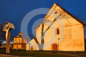 The cross with Jesus Christ near medieval church of St. Francis of Assisi in Poniky village