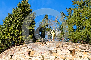 Cross with Jesus in village Turenne in French Correze