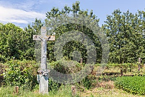Cross of Jezus and Maria in rural landscape near Hungarian Eger,