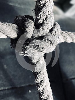 Cross knot of rough rope