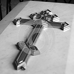 A cross on marble coffin