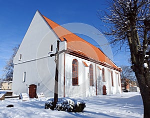 Cross and old rebuild church, Lithuania