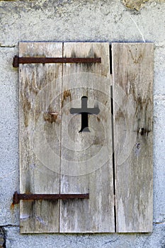 Cross in an old shutter, Le Frenalay, French Alps