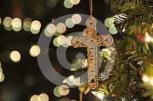 Cross ornament on christmas tree