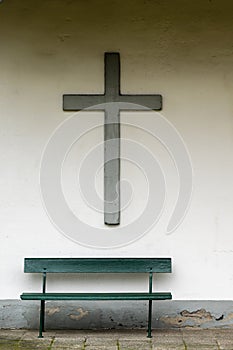 A cross over a bench