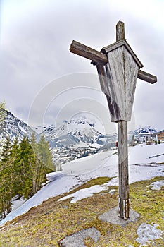 Cross overlooking the ski village of Lech