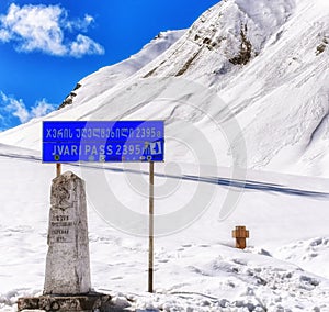 Cross pass Jvari Pass in Georgia. On the sign above there is a