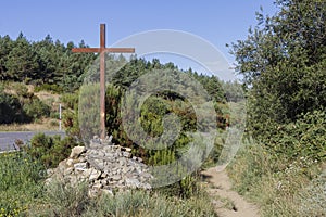 A cross beside the path where the pilgrims walk in the Camino de Santiago, Spain.
