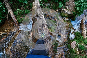 Cross the river on a log near Almaty