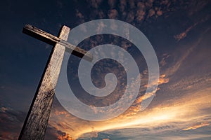 The cross of salvation in a beautiful sunset photo
