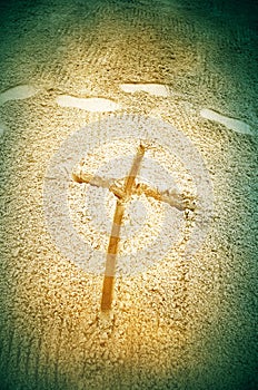 Cross in sand