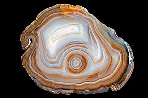 A cross section of the agate stone isolated on black background.