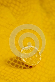 Cross section lemon yellow slice background close-up net netting packing package photo