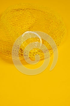 Cross section lemon yellow slice background close-up net netting packing package