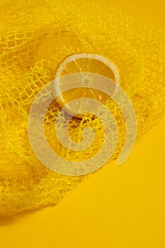 Cross section lemon yellow slice background close-up net netting packing package