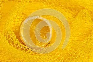Cross section lemon yellow slice background close-up net netting packing package photo