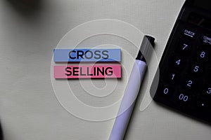 Cross-Selling text on sticky notes isolated on office desk