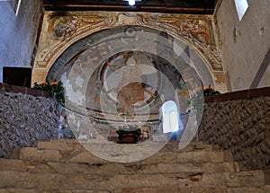 Cross shadow inside Italian romanesque church