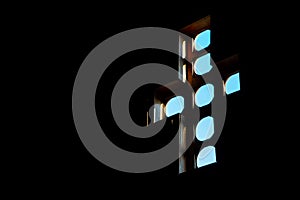 Cross-shaped church window, sunlight coming in dark interior, abstract christian religious background