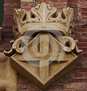 Cross shield under the royal crown