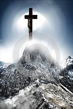 Cross shining on mountain like a miracle