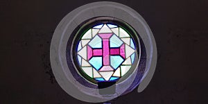 Cross in stained glass window